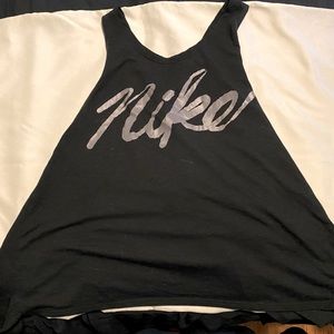 Black Nike running tanktop.  Open back w/ crisscross upper body detail, size: M